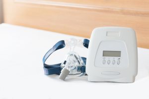 CPAP machine on bed